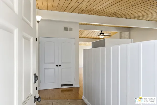 a view of a hallway with closet