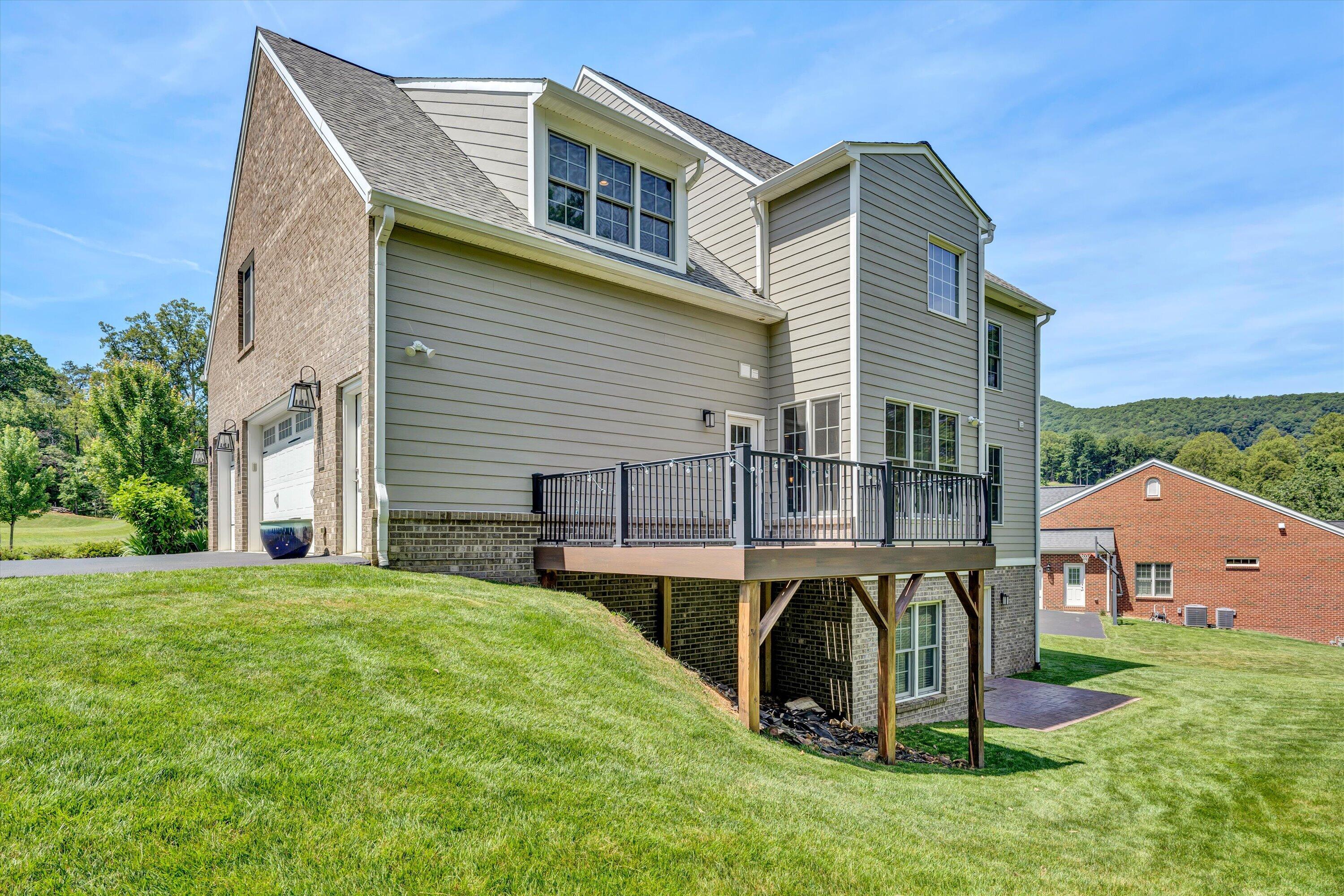 6981 Fairway Ridge Road Salem, VA 24153 - Photo 47 of 53 a view of a house with a yard and sitting area