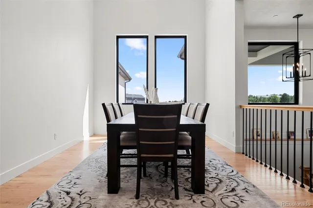 a spacious bedroom with a bed and a flat tv screen