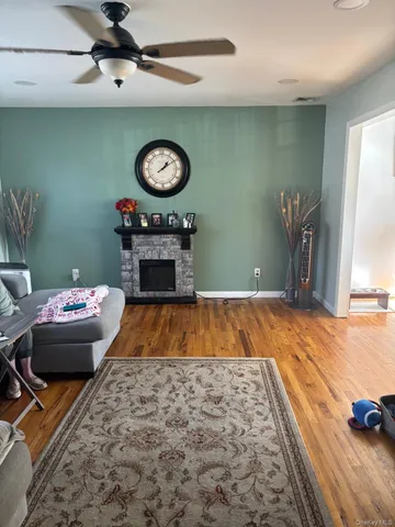 a view of a livingroom with furniture and a fireplace