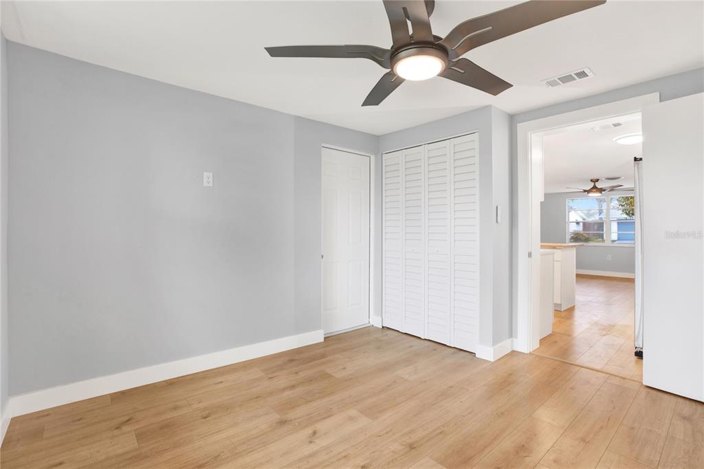 5200 Dove Drive New Port Richey, FL 34652 - Photo 3 of 8 a view of empty room with wooden floor