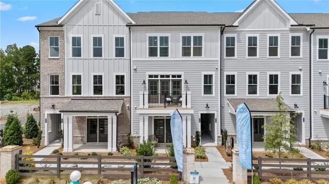 a view of a brick building with large windows