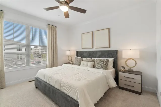 a bedroom with bed and window