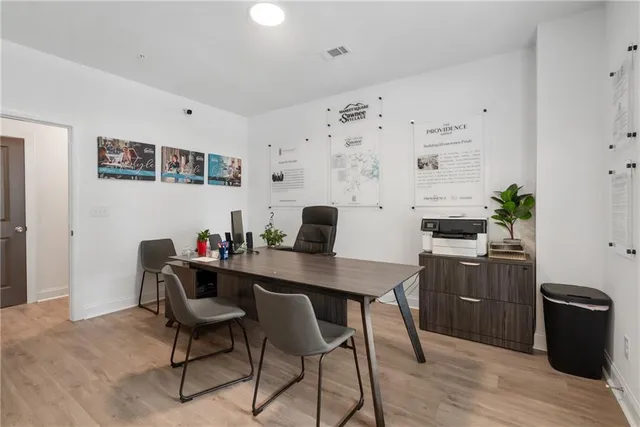 a workspace with furniture and wooden floor