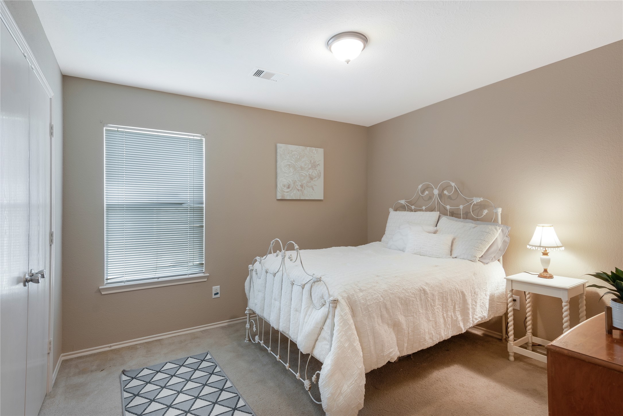16306 Rustic Stable Lane Cypress, TX 77429 - Photo 23 of 32 a bedroom with a bed and a window