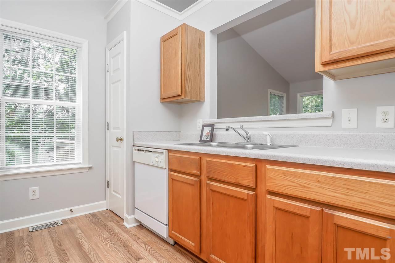 3121 Stedman Drive Raleigh, NC 27607 - Photo 11 of 25 a bathroom with a sink and a window
