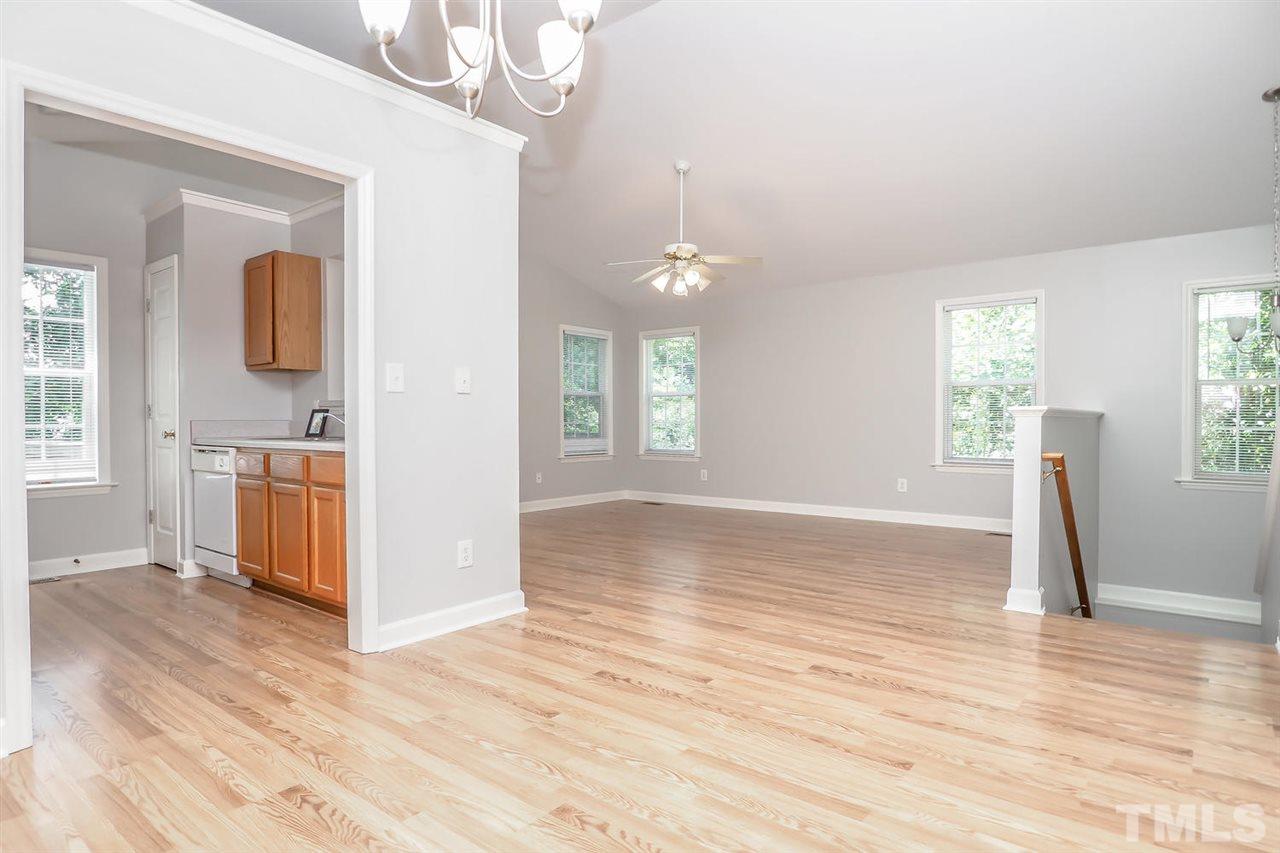 3121 Stedman Drive Raleigh, NC 27607 - Photo 12 of 25 a view of a kitchen with wooden floor and a window