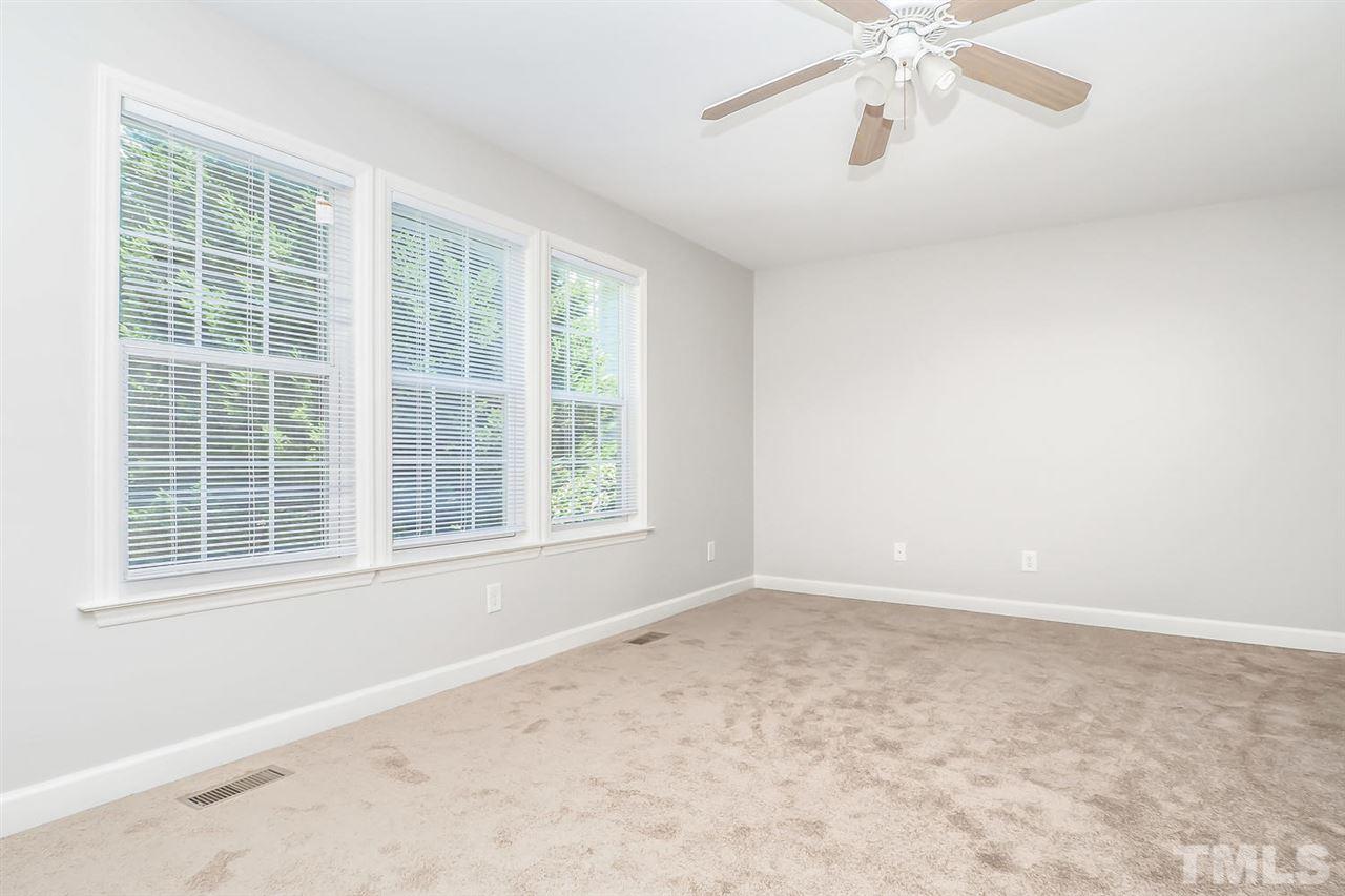 3121 Stedman Drive Raleigh, NC 27607 - Photo 14 of 25 an empty room with a window and a fan
