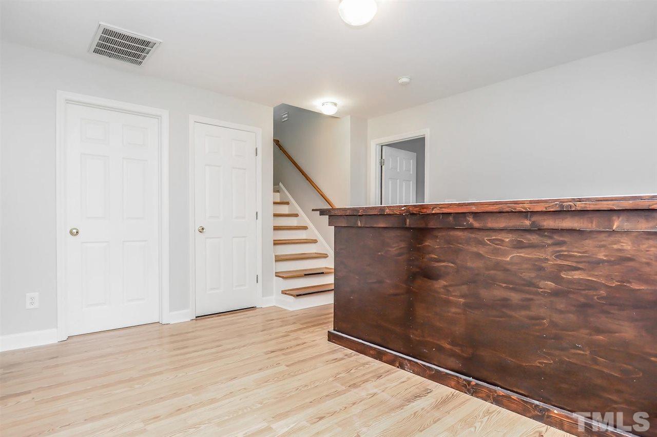 3121 Stedman Drive Raleigh, NC 27607 - Photo 19 of 25 a view of entryway with wooden floor