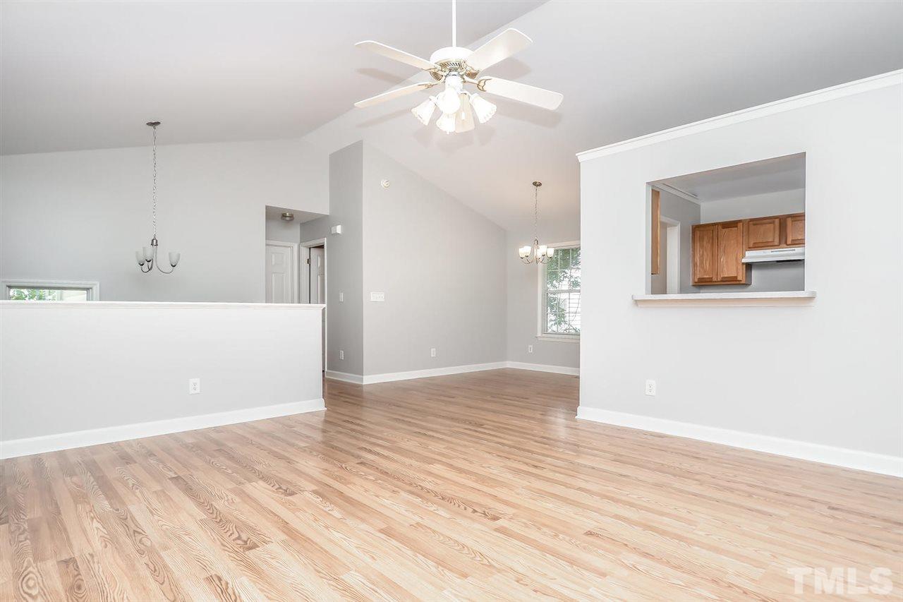 3121 Stedman Drive Raleigh, NC 27607 - Photo 3 of 25 a view of an empty room with window and wooden floor