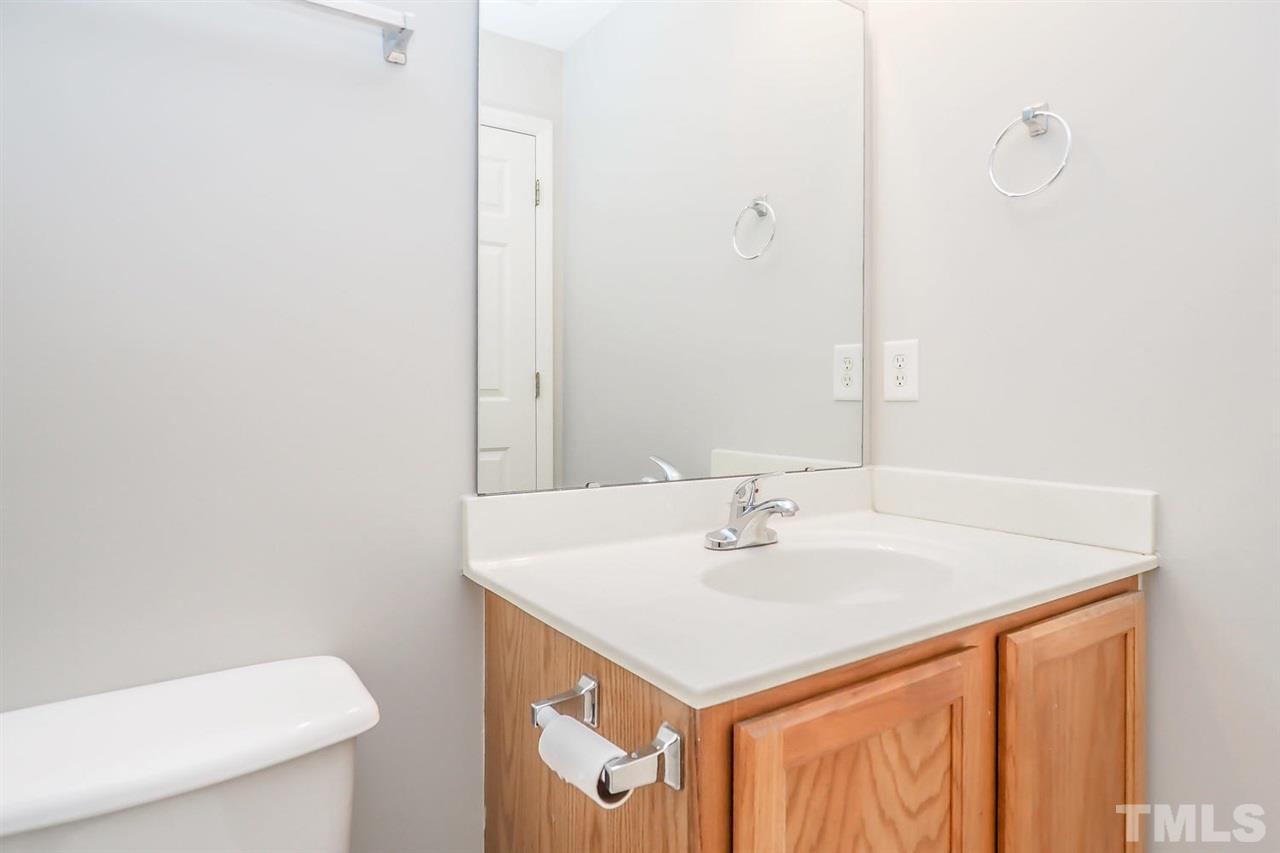 3121 Stedman Drive Raleigh, NC 27607 - Photo 21 of 25 a bathroom with a sink a toilet and a mirror