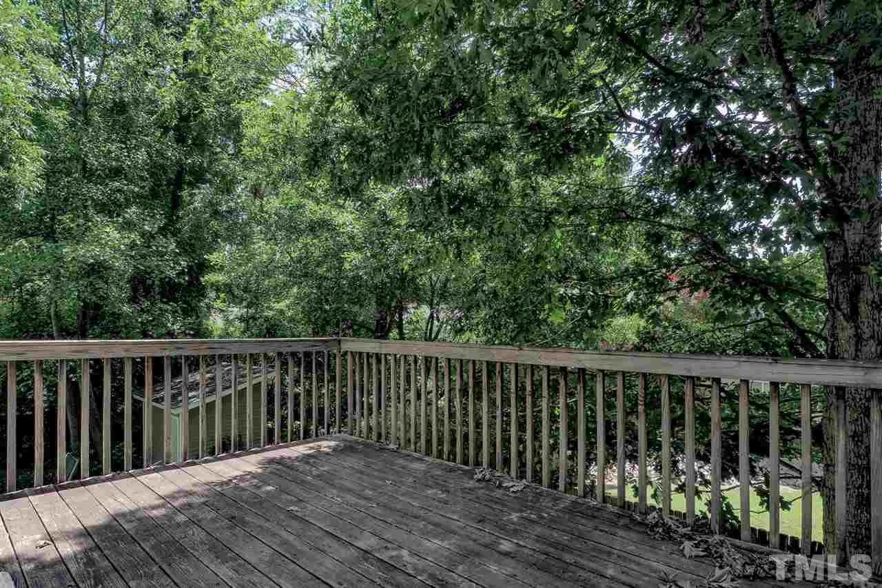 3121 Stedman Drive Raleigh, NC 27607 - Photo 24 of 25 a balcony with wooden floor and fence