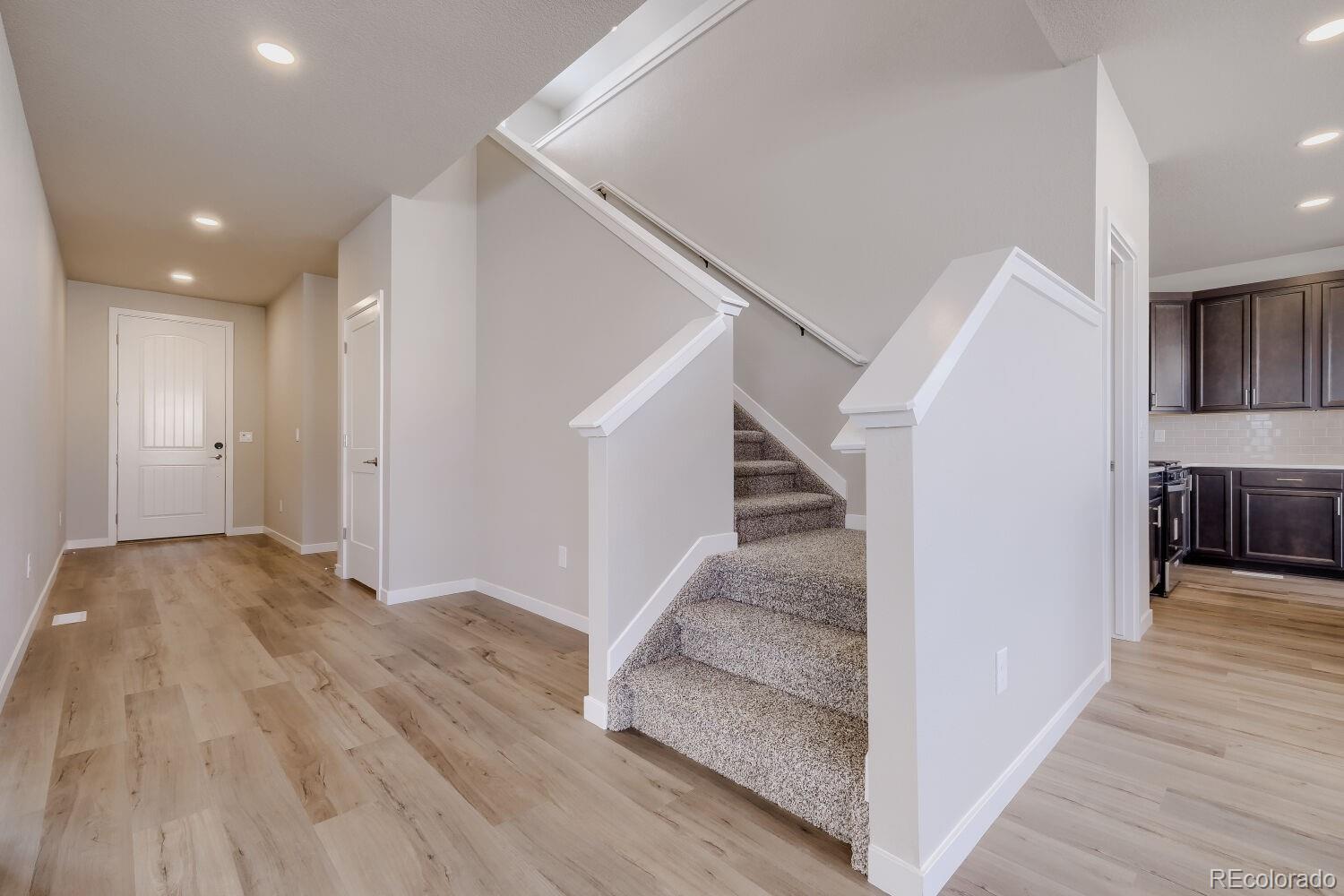471 Atchison Way Calhan, CO 80808 - Photo 4 of 31 a view of entryway and hall with wooden floor