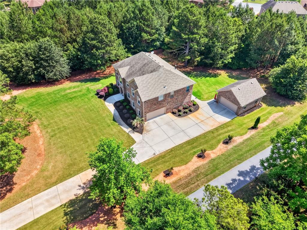 2300 Tucker Mill Road Southwest Conyers, GA 30094 - Photo 3 of 45 an aerial view of a house with a garden