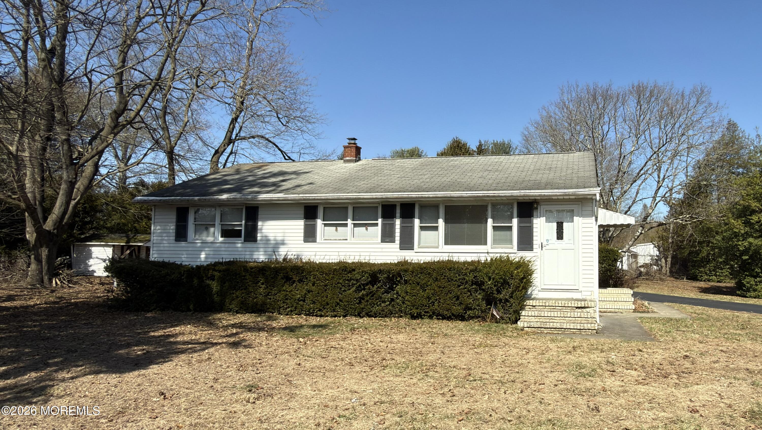 325 Sharon Road Hightstown, NJ 08520 - Photo 1 of 13 a front view of a house with a yard