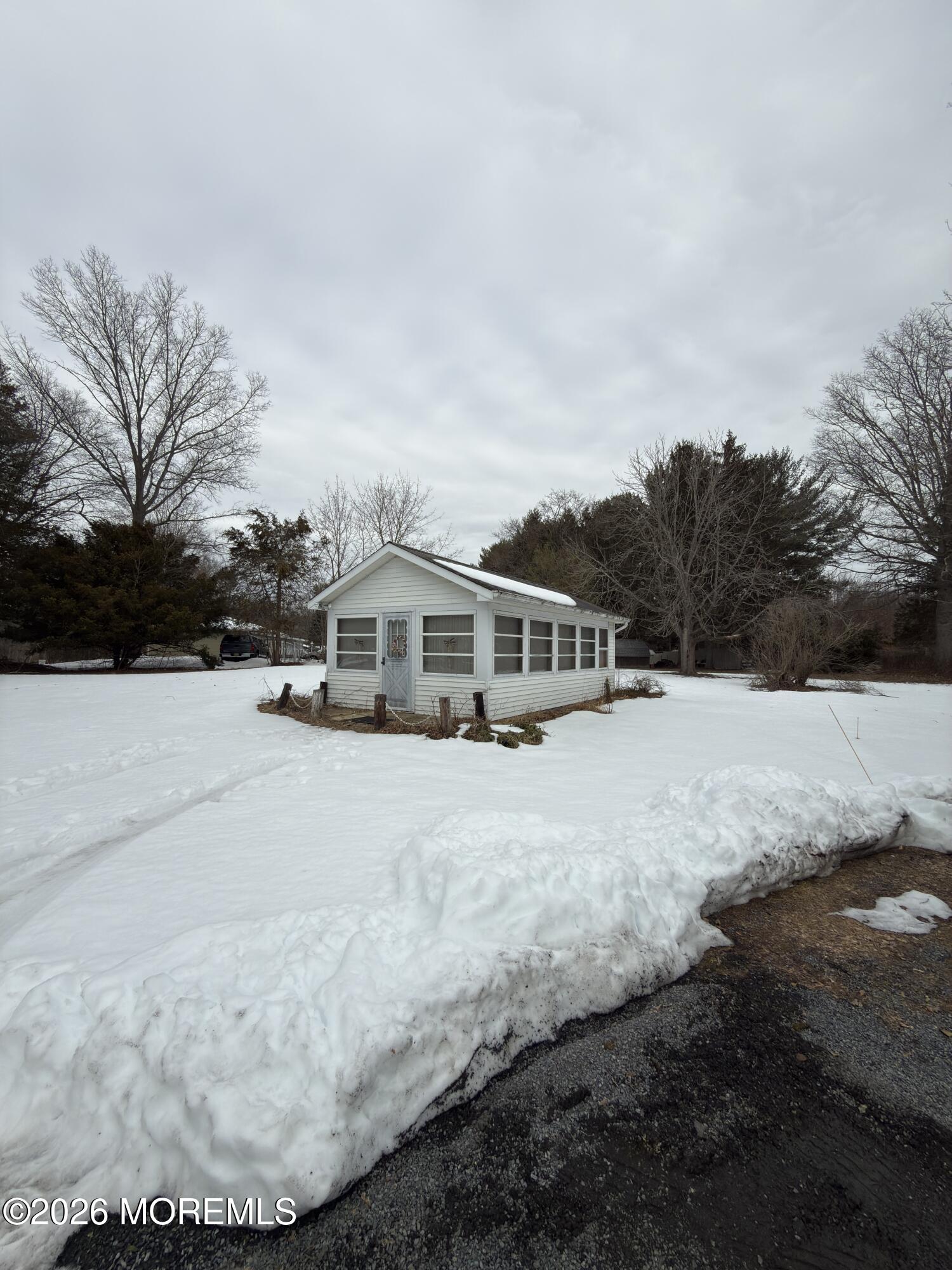 325 Sharon Road Hightstown, NJ 08520 - Photo 12 of 13 a view of a house with snow on the background