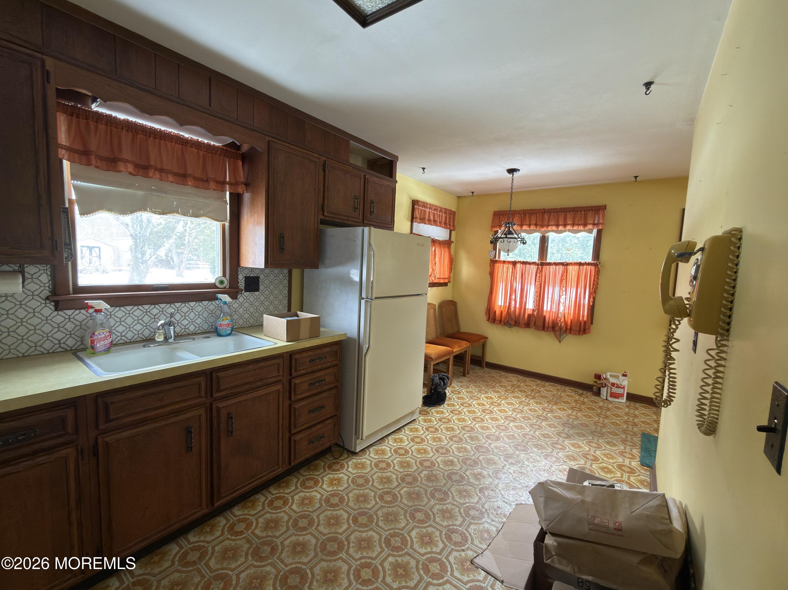 325 Sharon Road Hightstown, NJ 08520 - Photo 5 of 13 a kitchen with refrigerator and window