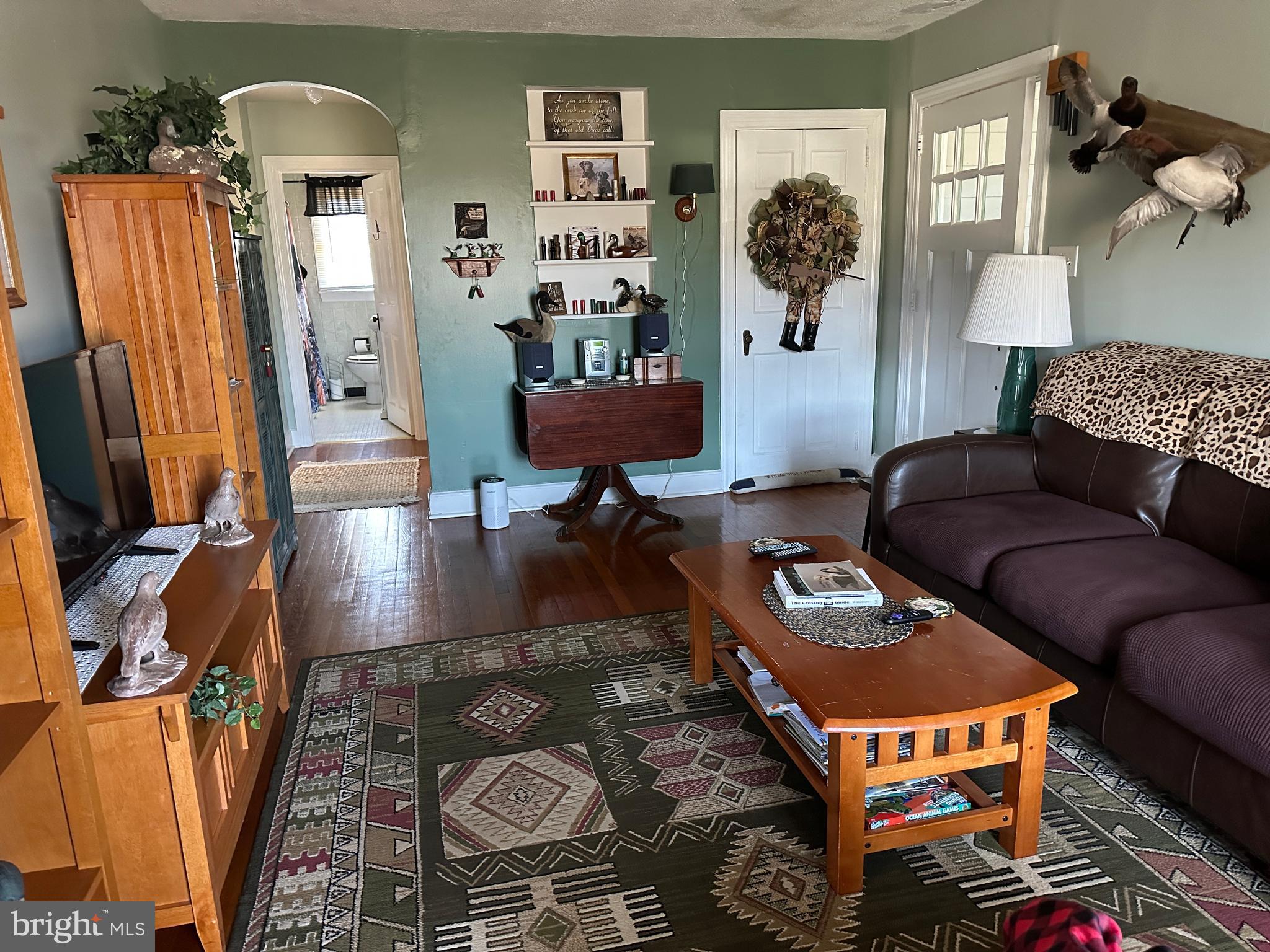 2775 Toddville Road Toddville, MD 21672 - Photo 49 of 59 a living room with furniture rug and window