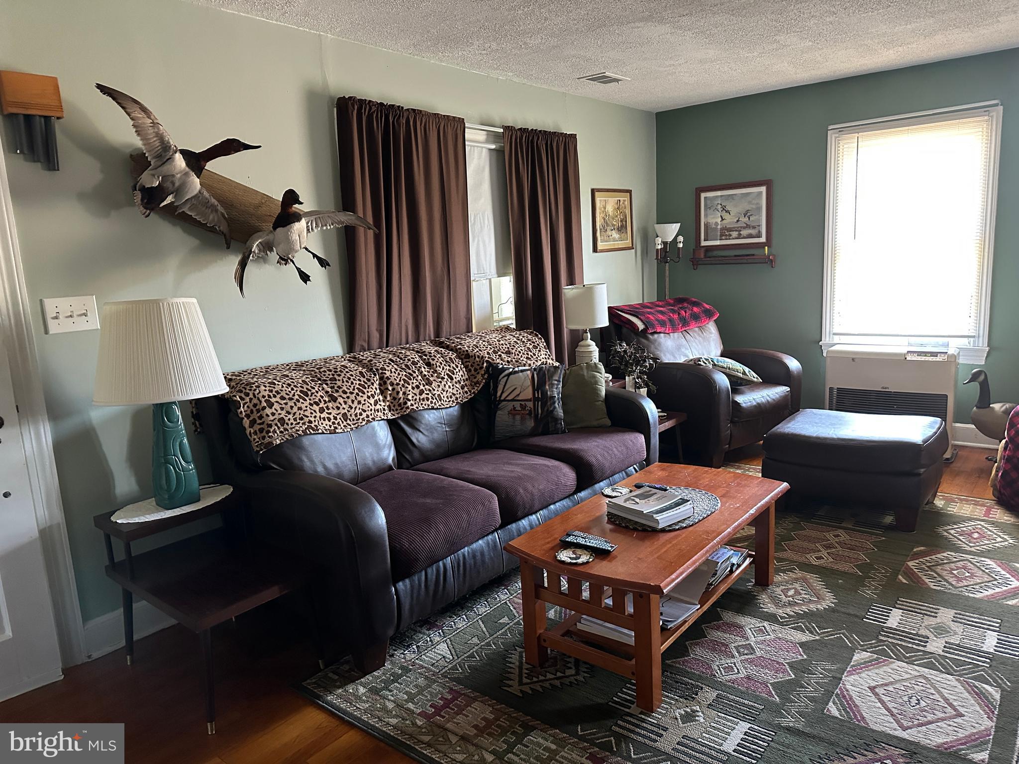 2775 Toddville Road Toddville, MD 21672 - Photo 50 of 59 a living room with furniture and a window