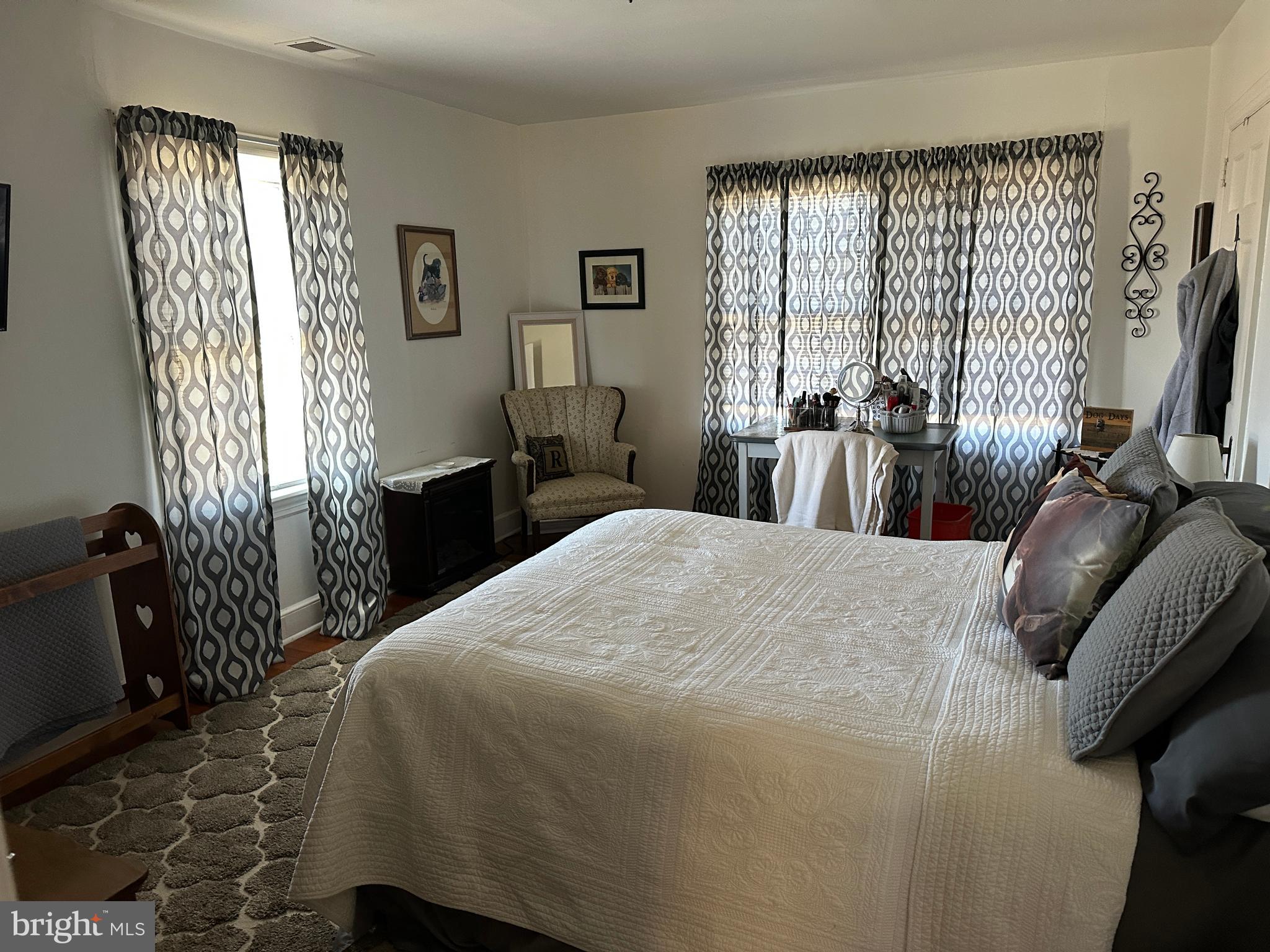 2775 Toddville Road Toddville, MD 21672 - Photo 55 of 59 a bedroom with a bed and wooden floor
