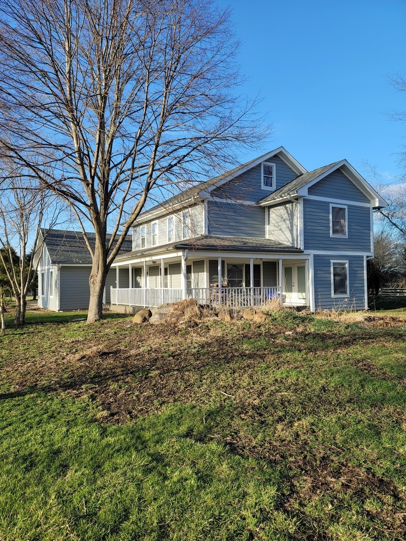 8410 Brisbin Road Morris, IL 60450 - Photo 1 of 1 a front view of a house with a garden