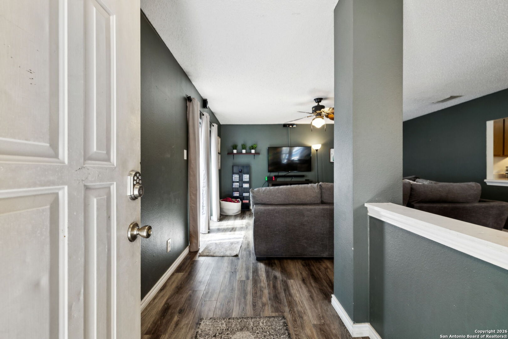 6622 Evenridge Lane San Antonio, TX 78239 - Photo 4 of 21 a living room with furniture and a flat screen tv