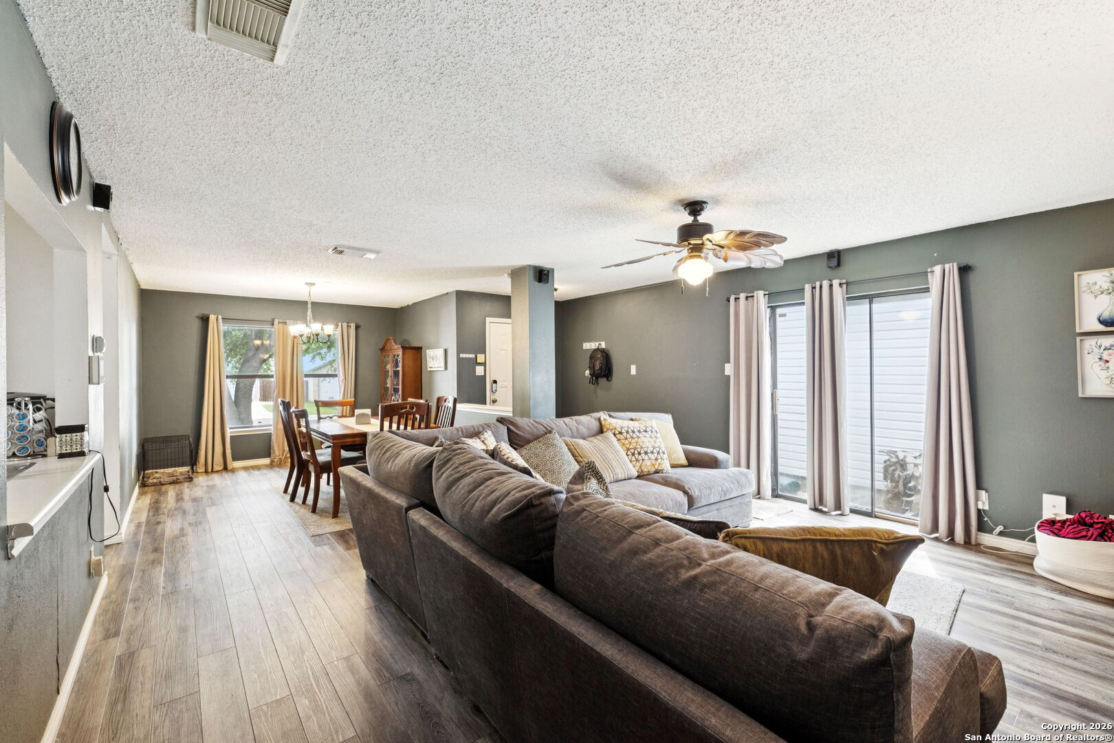 6622 Evenridge Lane San Antonio, TX 78239 - Photo 6 of 21 a living room with furniture and a chandelier