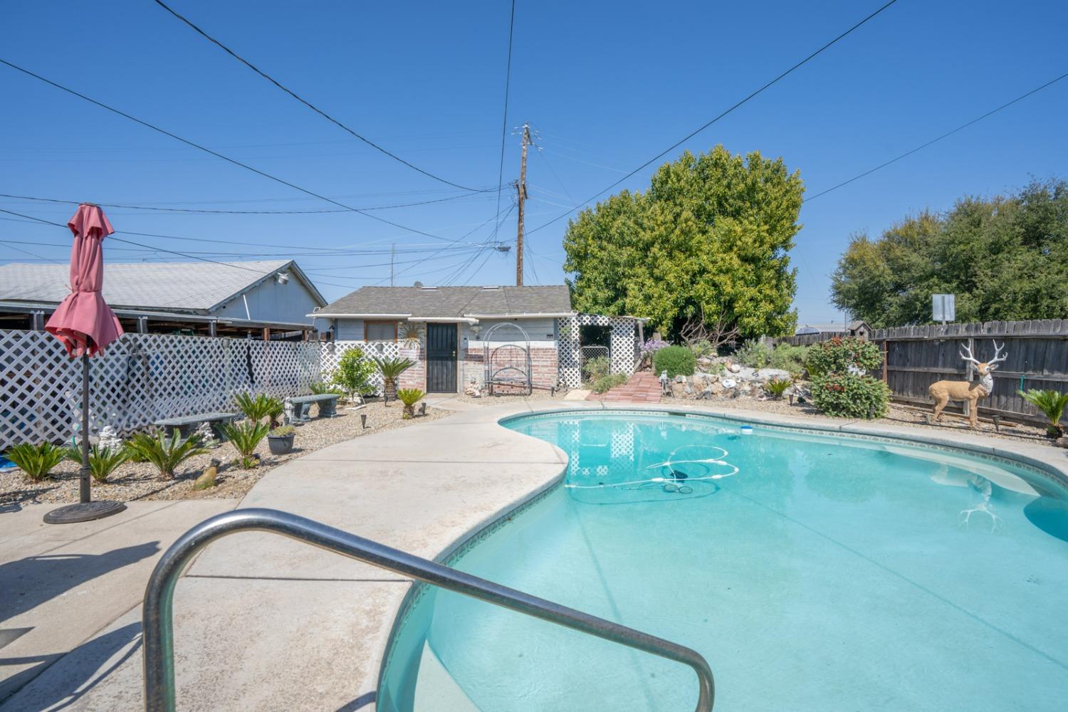 1164 J Street Reedley, CA 93654 - Photo 12 of 43 swimming pool view with a seating space
