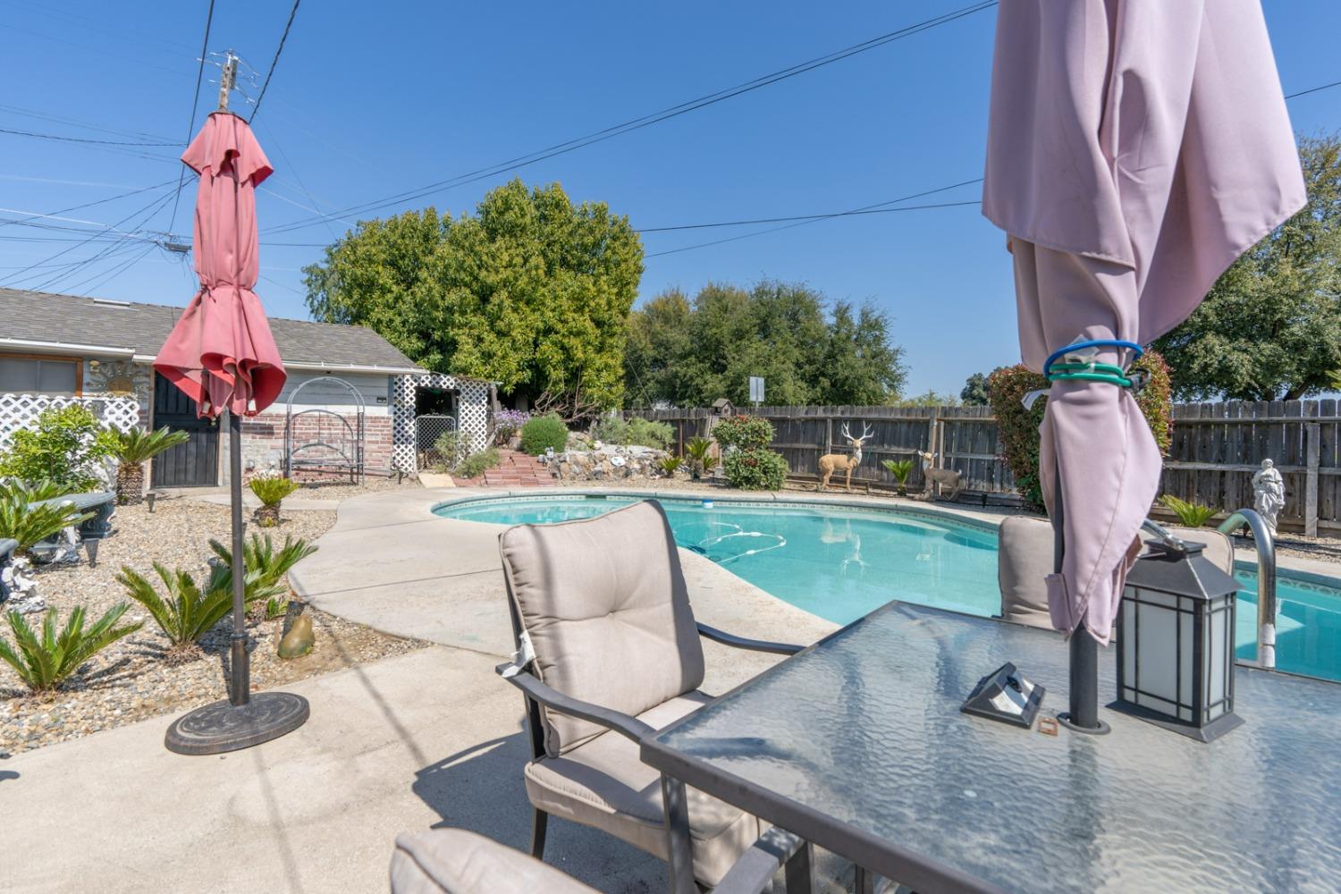 1164 J Street Reedley, CA 93654 - Photo 15 of 43 a view of a backyard with furniture