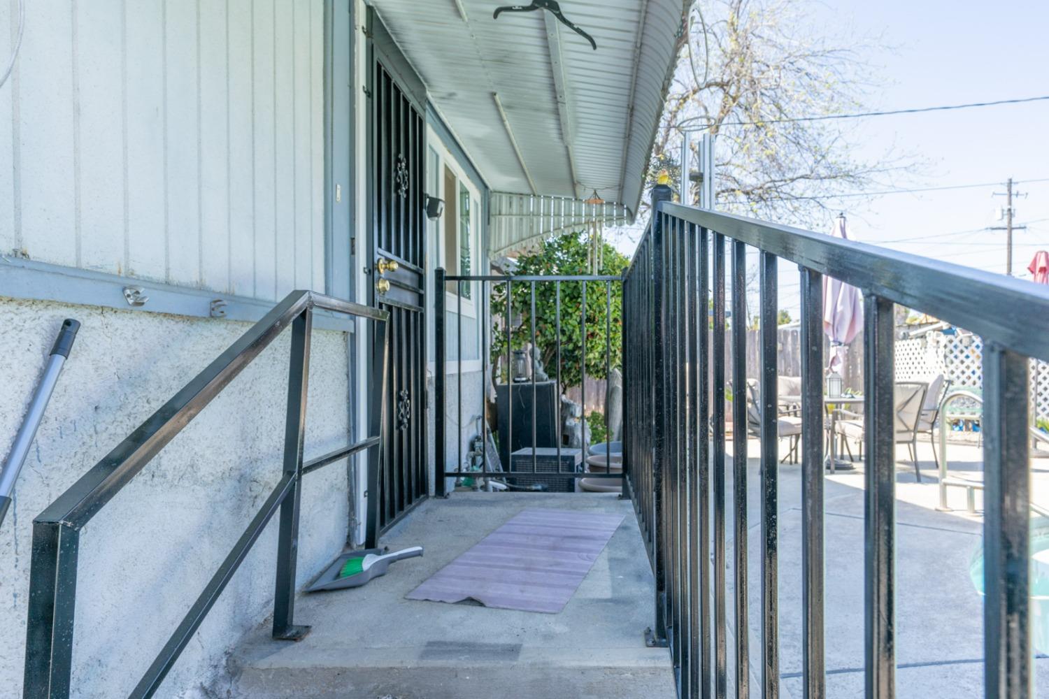 1164 J Street Reedley, CA 93654 - Photo 19 of 43 a view of a house with wooden floor and stairs