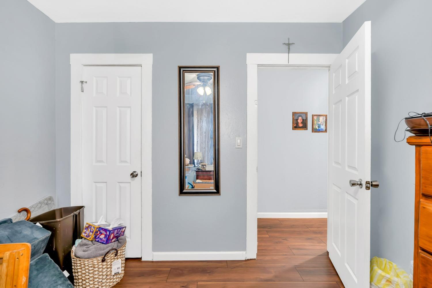1164 J Street Reedley, CA 93654 - Photo 36 of 43 a view of a hallway with wooden floor and closet