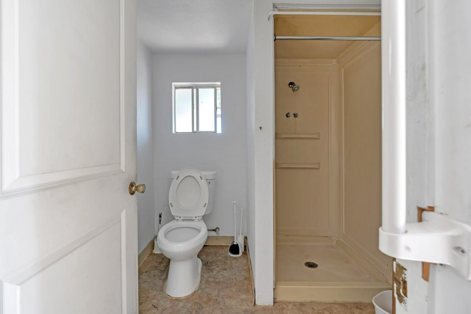 1164 J Street Reedley, CA 93654 - Photo 42 of 43 a bathroom with a toilet