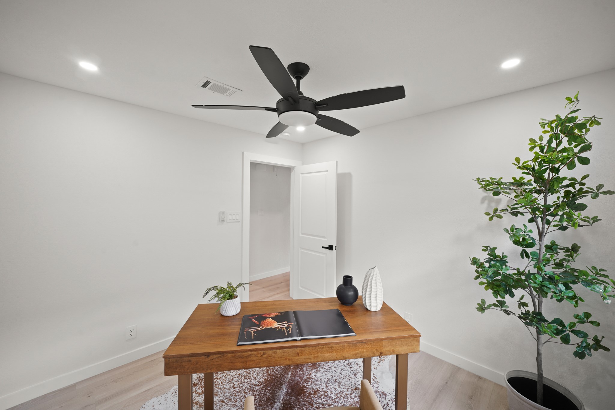4813 Hummingbird Street Houston, TX 77035 - Photo 18 of 50 Wide Plank White Oak Hued Engineered Floors, Contemporary Style Ceiling Fan with Light, and LED Flush Mounts are Additional Features in the Second Bedroom.