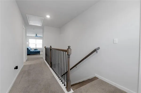 a view of a hallway view with staircase
