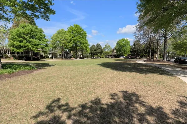 a view of a field and trees