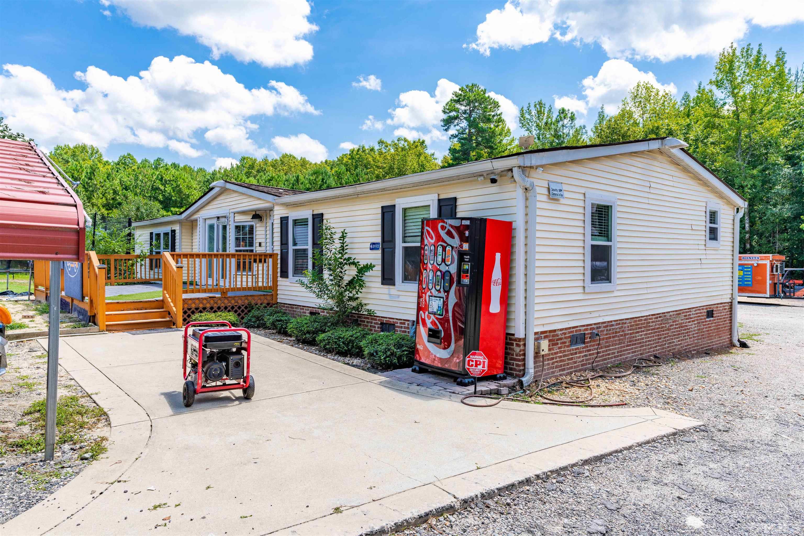 407 David Road Wendell, NC 27591 - Photo 1 of 39 a view of a small house in the back yard of the house
