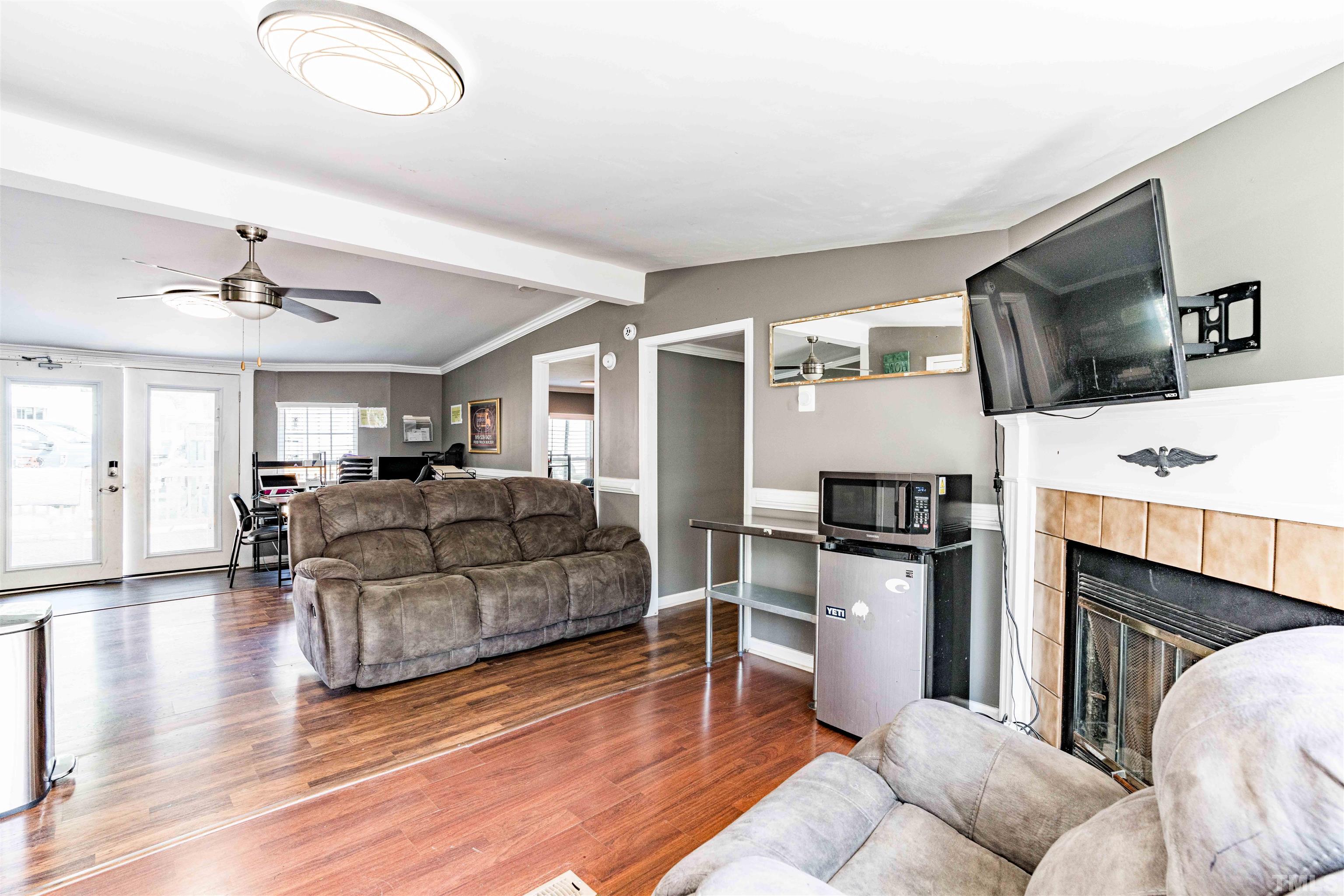 407 David Road Wendell, NC 27591 - Photo 12 of 39 a living room with furniture and a flat screen tv