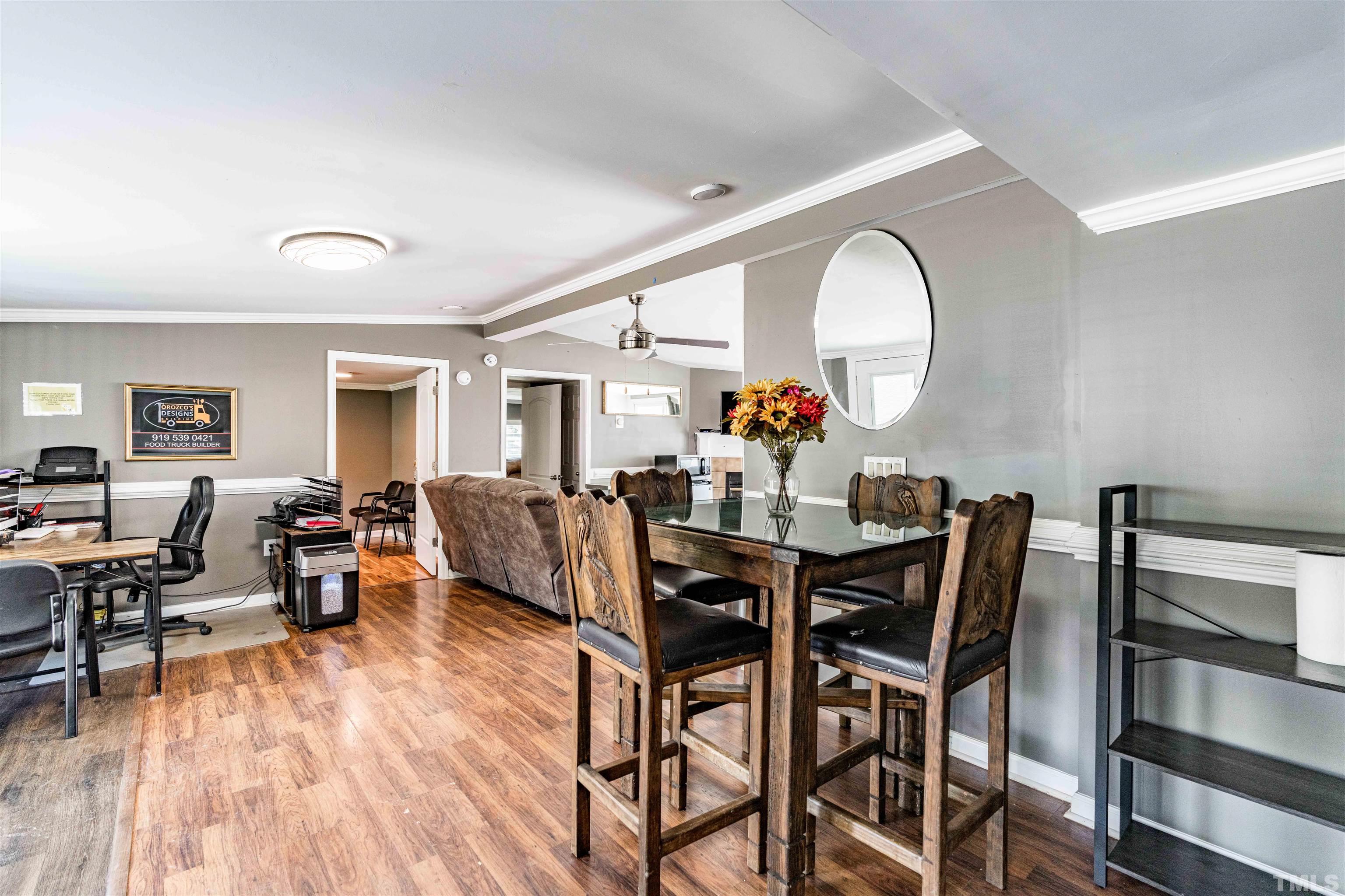 407 David Road Wendell, NC 27591 - Photo 15 of 39 a view of a dining room with furniture and wooden floor