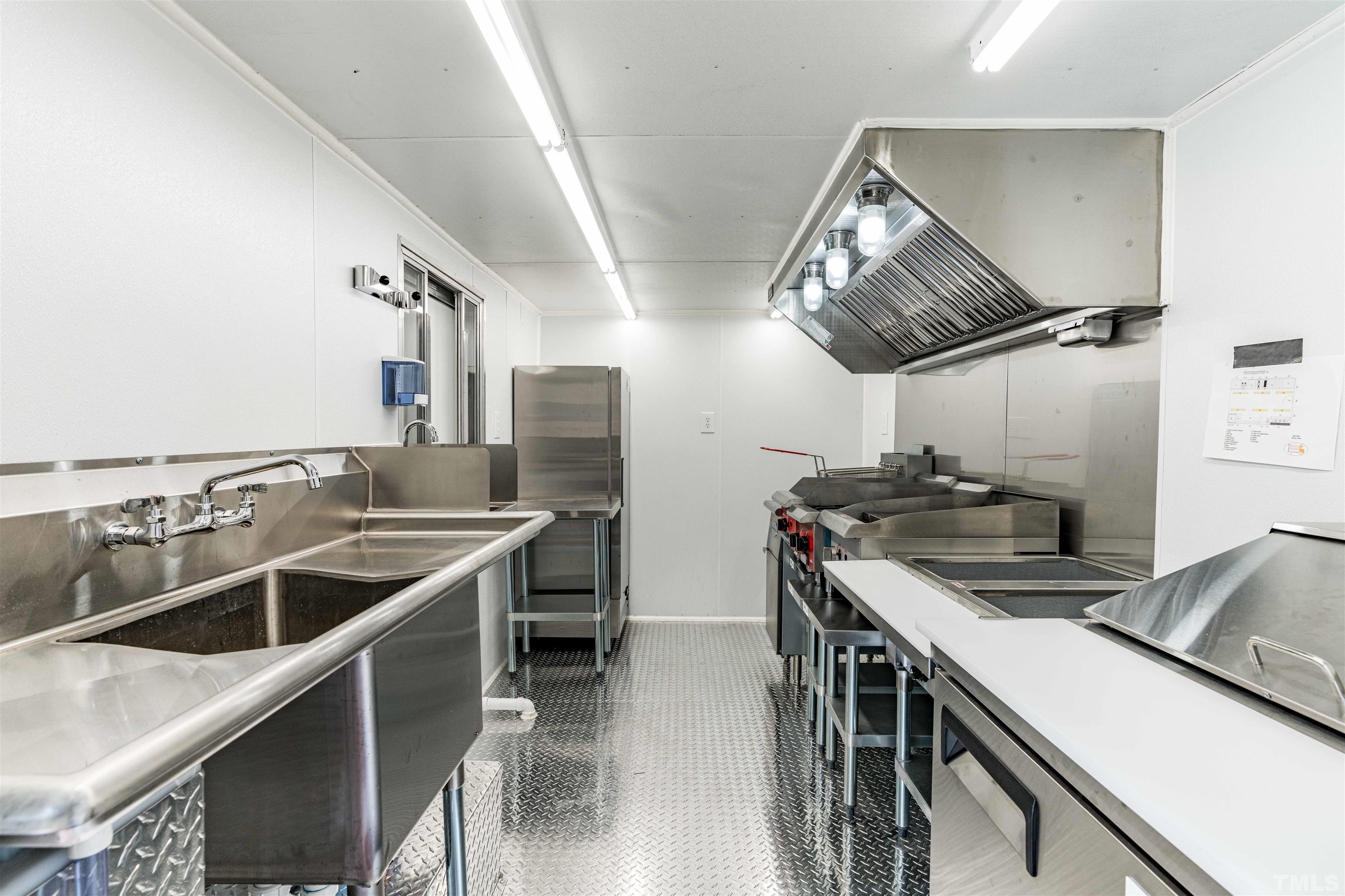 407 David Road Wendell, NC 27591 - Photo 16 of 39 a kitchen that has a sink and a stove