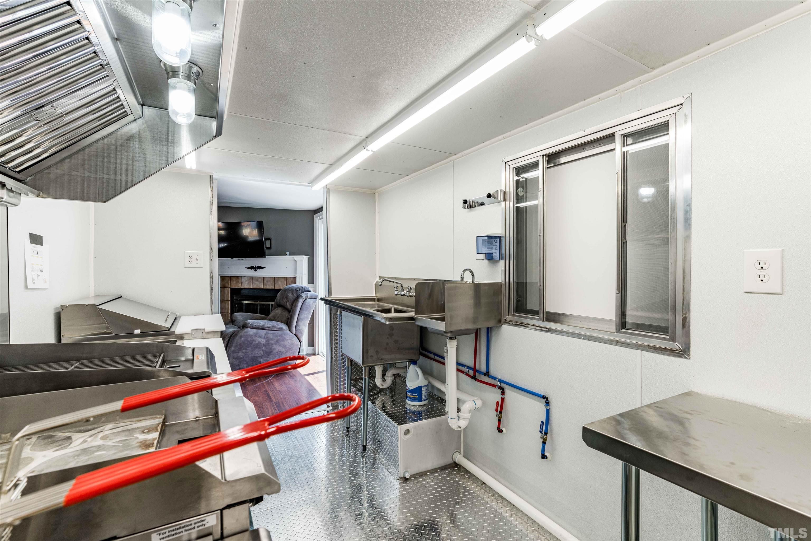 407 David Road Wendell, NC 27591 - Photo 17 of 39 a view of a room with gym equipment