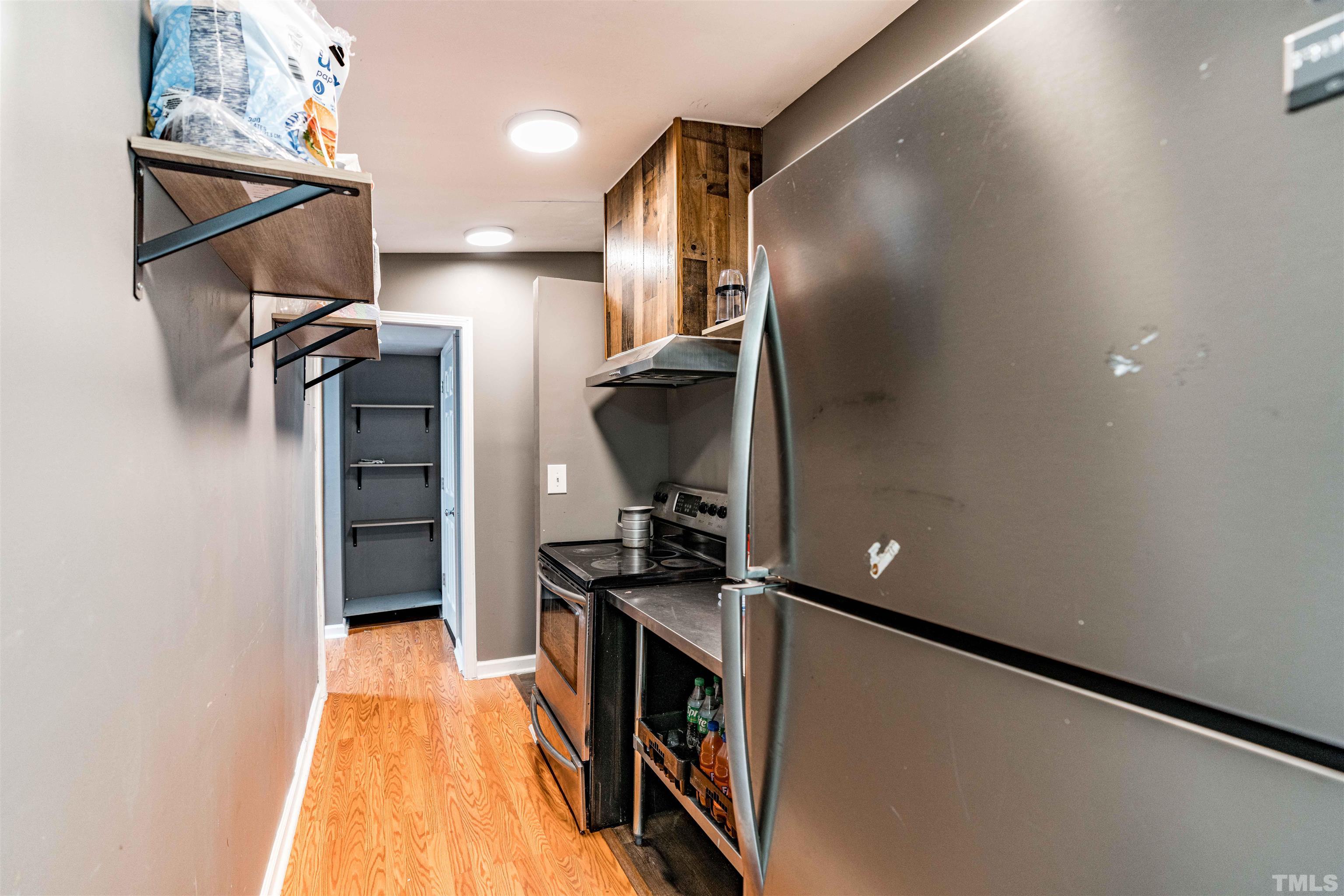 407 David Road Wendell, NC 27591 - Photo 18 of 39 a kitchen with stainless steel appliances granite countertop a refrigerator and a stove top oven