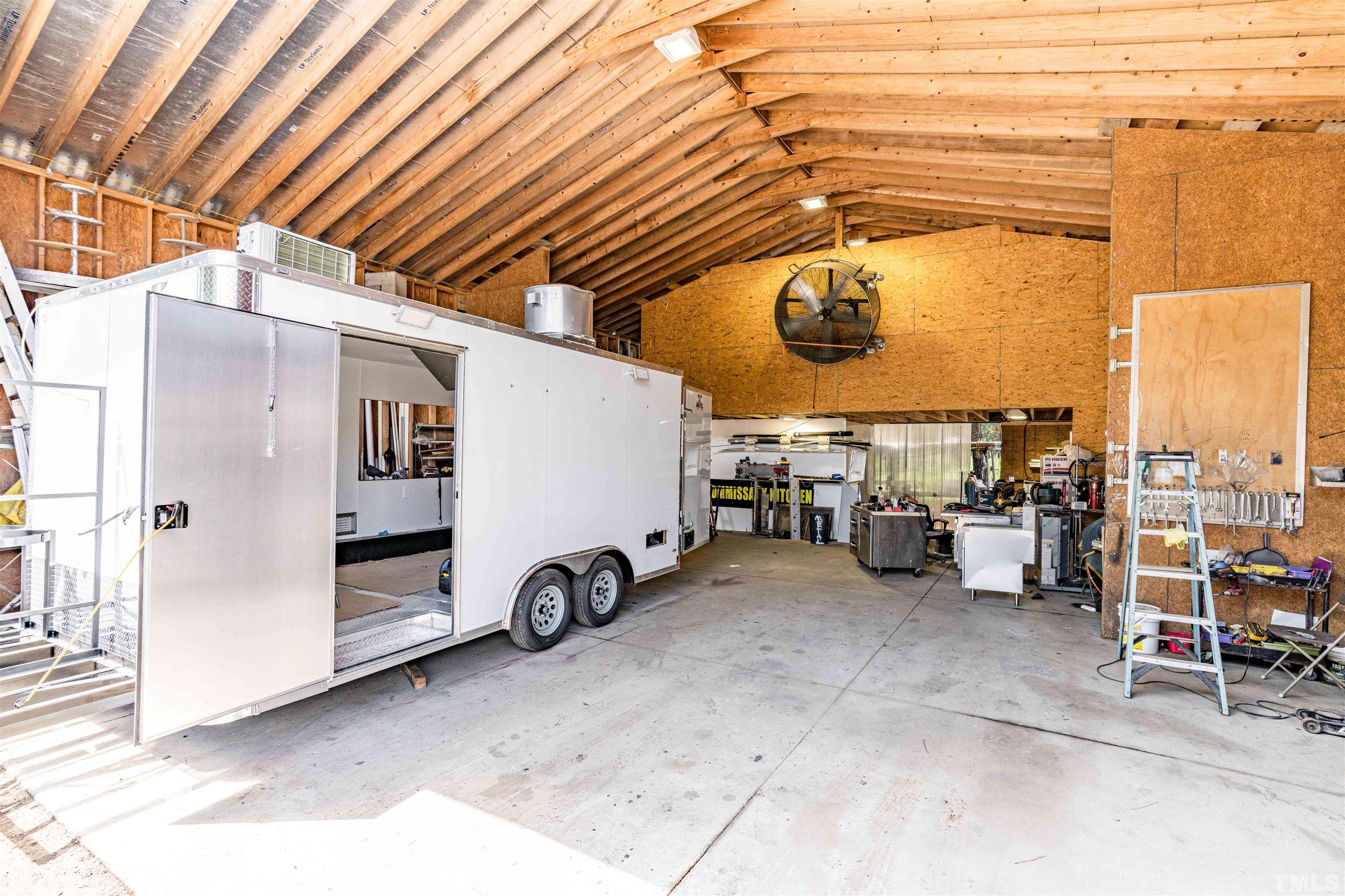 407 David Road Wendell, NC 27591 - Photo 26 of 39 a view of a garage with table and chairs