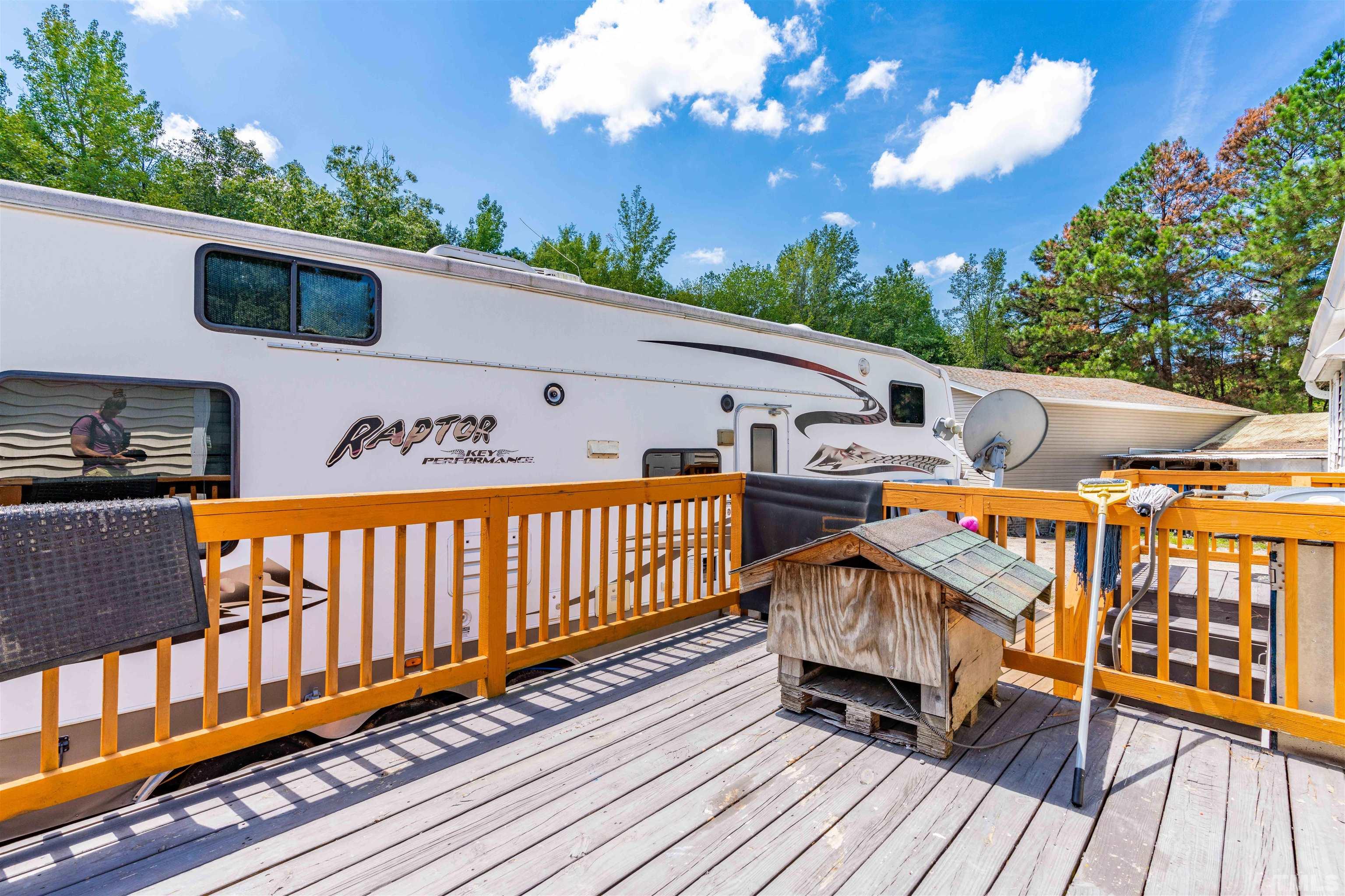 407 David Road Wendell, NC 27591 - Photo 34 of 39 a view of a deck with wooden floor and barbeque oven