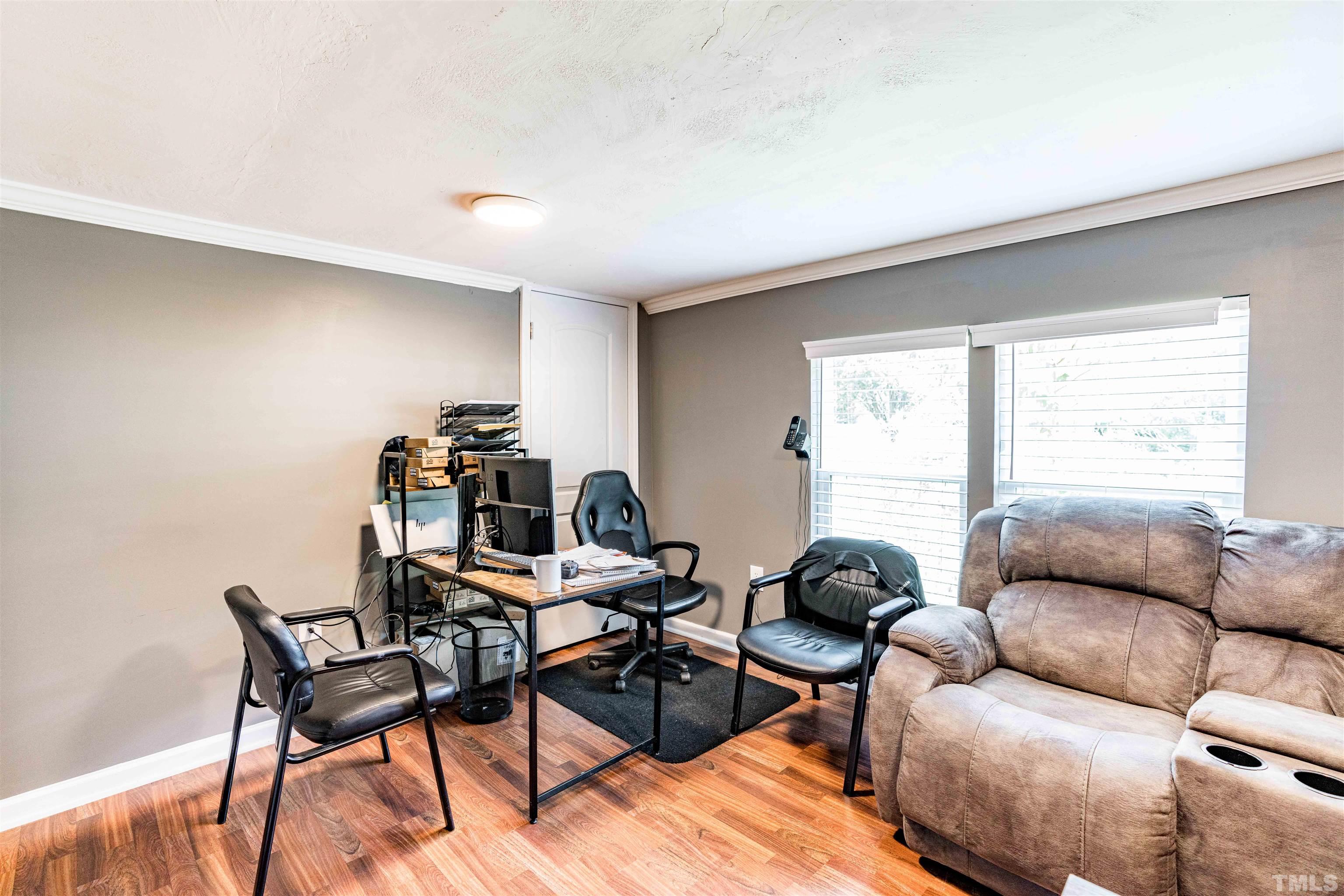 407 David Road Wendell, NC 27591 - Photo 4 of 39 a living room with furniture and a window