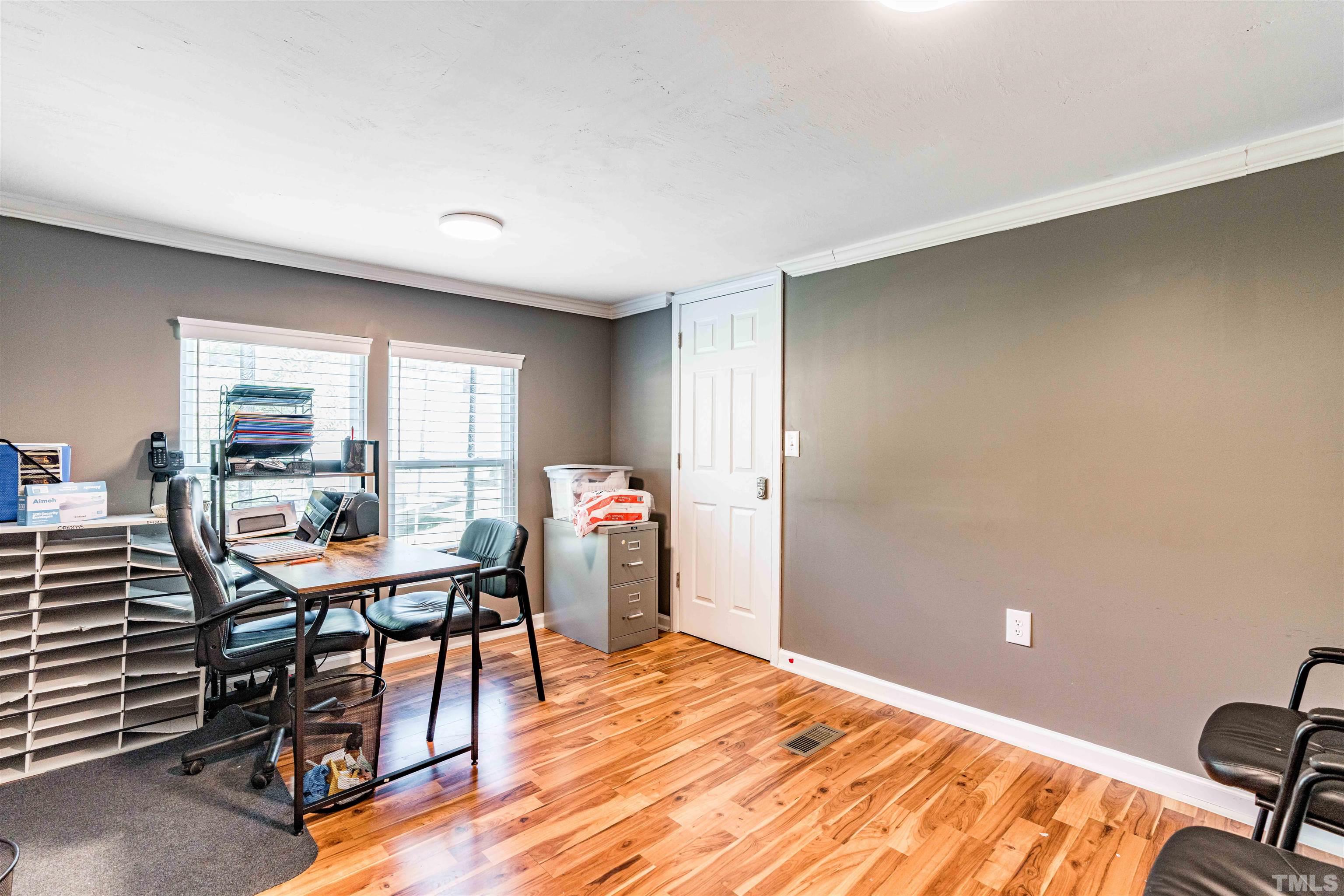 407 David Road Wendell, NC 27591 - Photo 6 of 39 a workspace with furniture and window