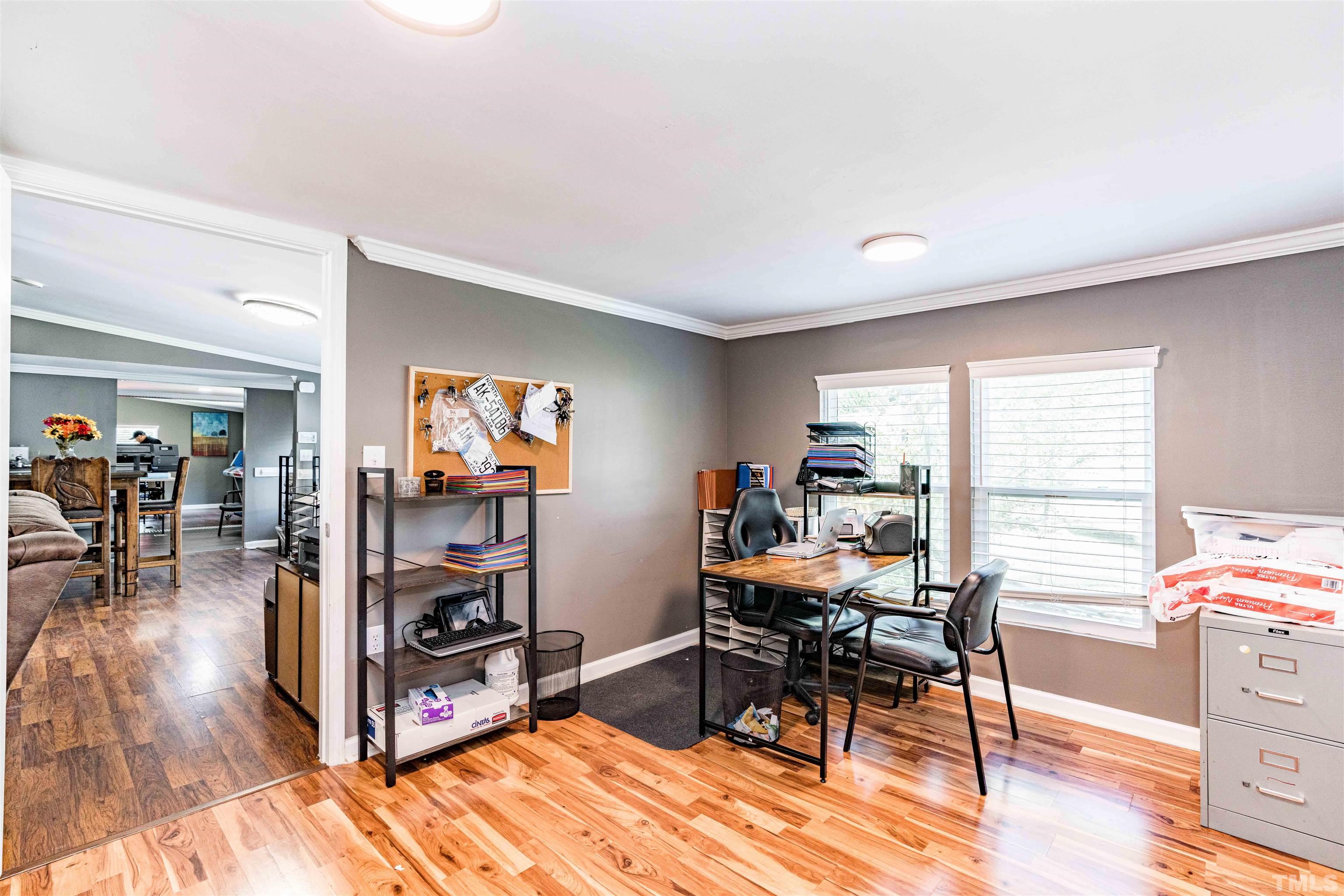 407 David Road Wendell, NC 27591 - Photo 7 of 39 a workspace with furniture and a livingroom