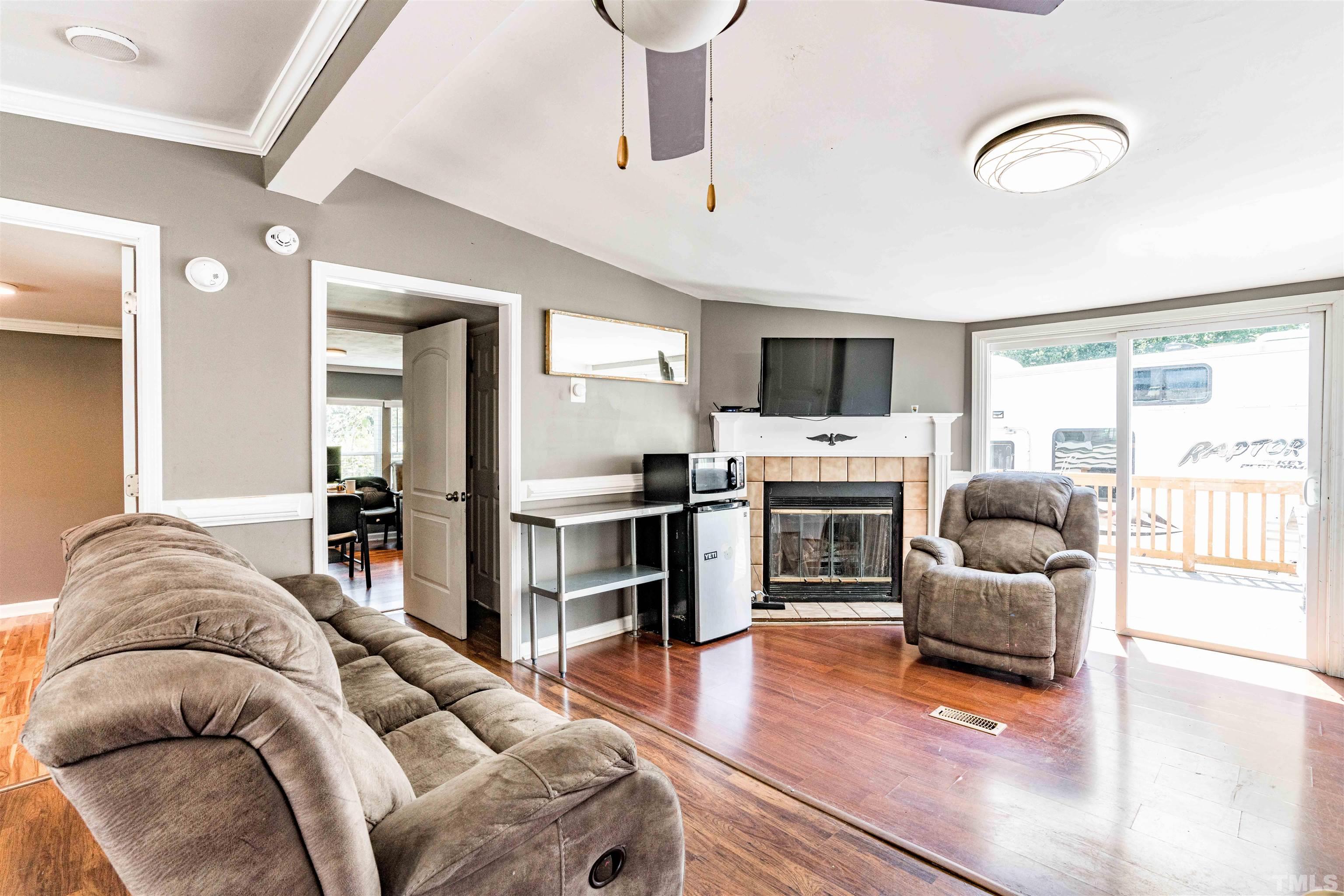 407 David Road Wendell, NC 27591 - Photo 8 of 39 a living room with furniture and a fireplace