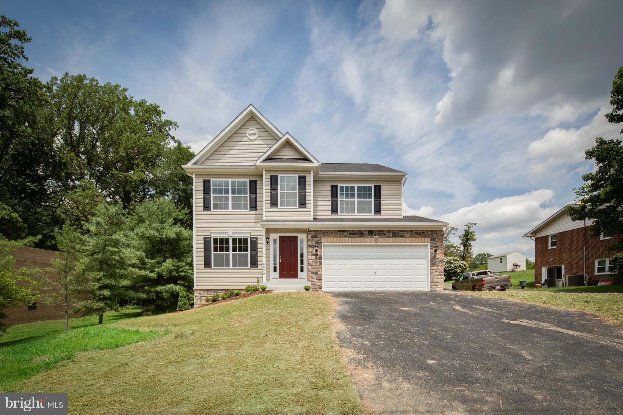 4 Hanover Road Hanover, MD 21076 - Photo 1 of 30 a front view of a house with a yard and garage