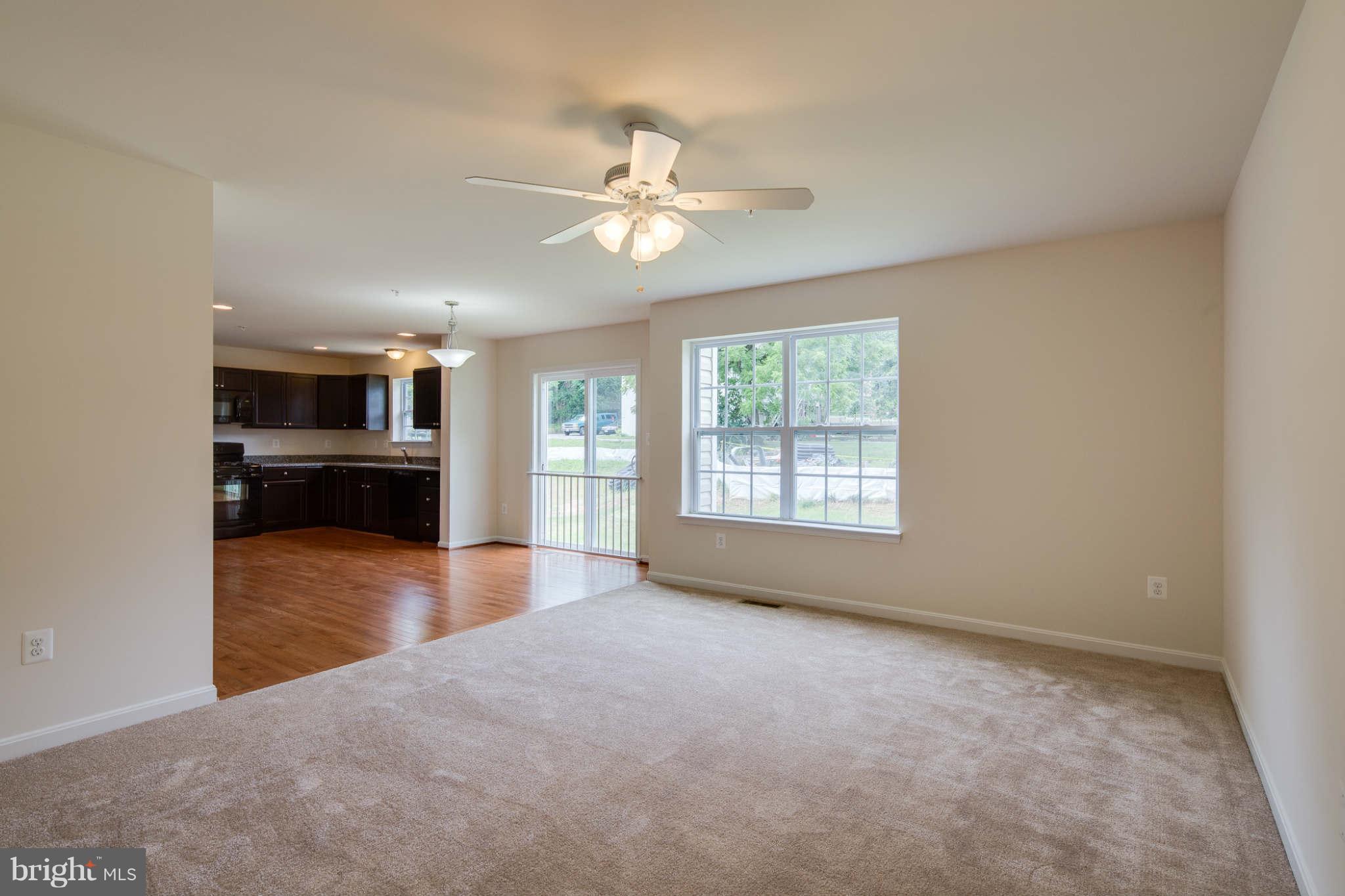 4 Hanover Road Hanover, MD 21076 - Photo 11 of 30 an empty room with chandelier and windows
