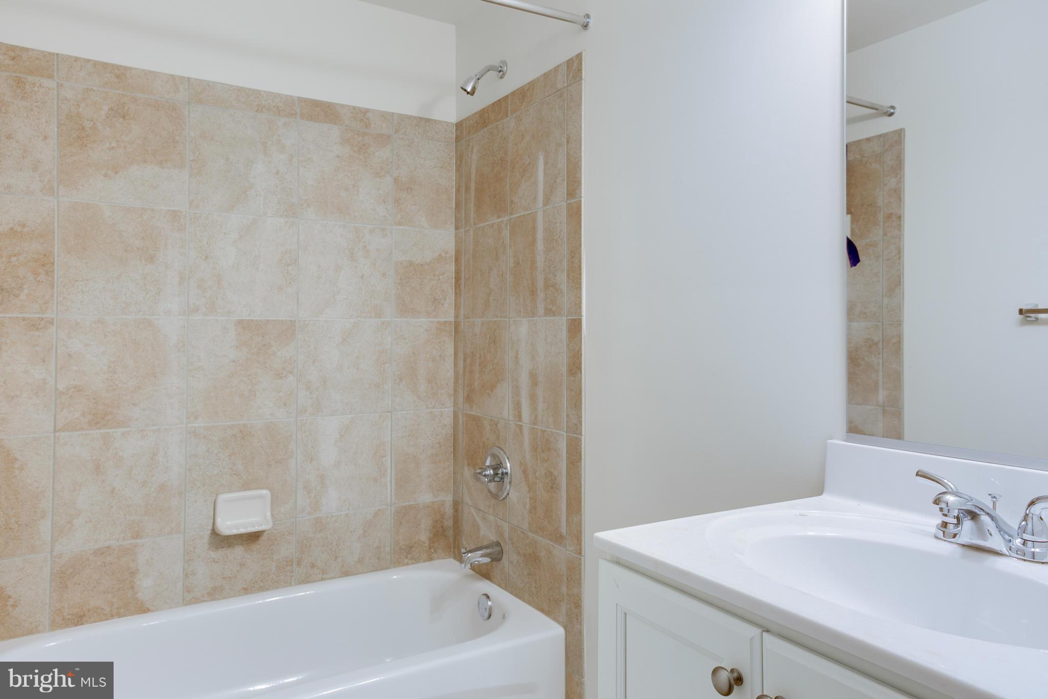 4 Hanover Road Hanover, MD 21076 - Photo 17 of 30 a bath room with a sink and a bath tub